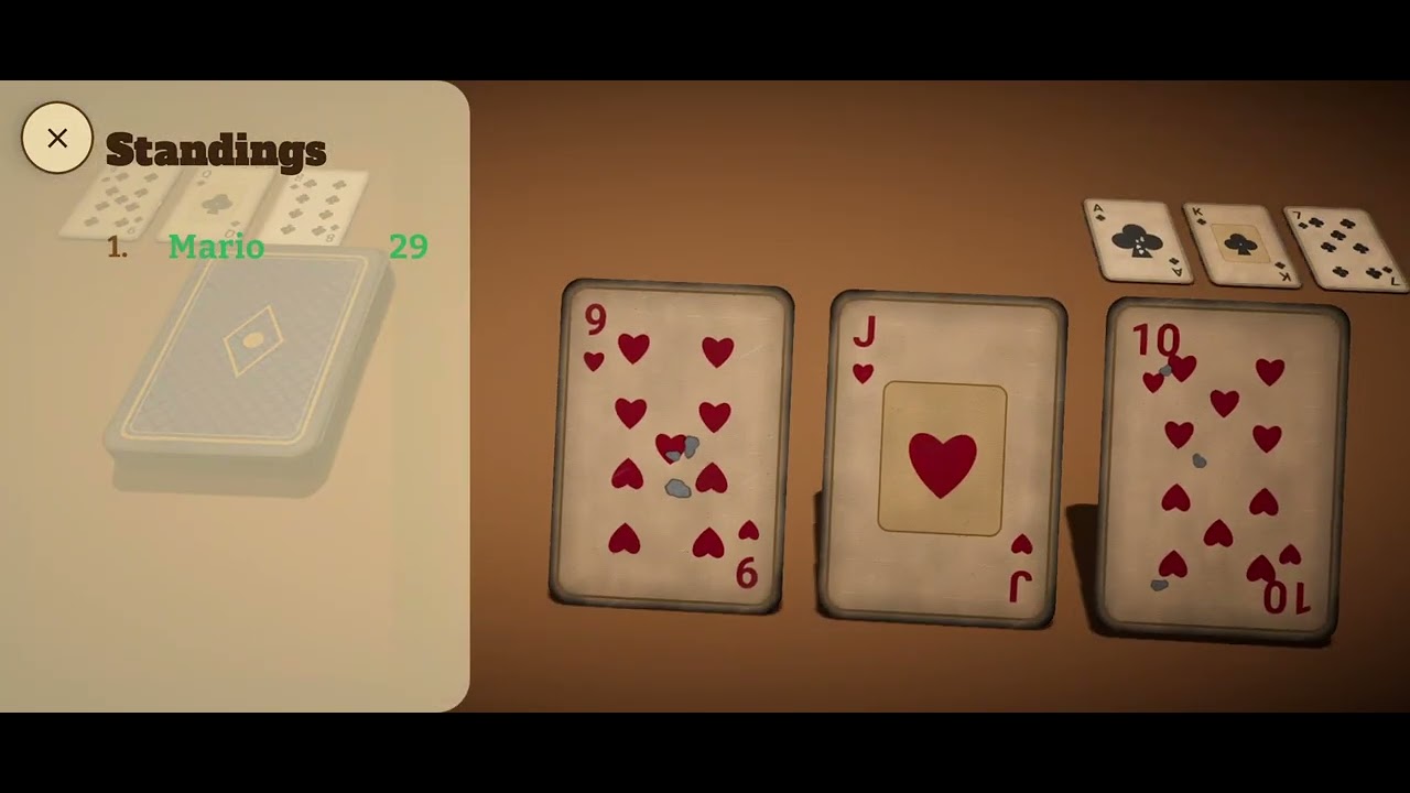 Knack trailer — a run of hearts on the table, the standings open beside it